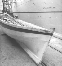 a longboat waiting on the quay