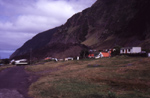 Settlement with volcano in background